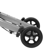 Close-up of a stroller wheel on a white background