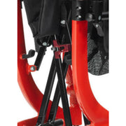 Close-up of a red and black mechanical component, possibly part of a vehicle or machinery.