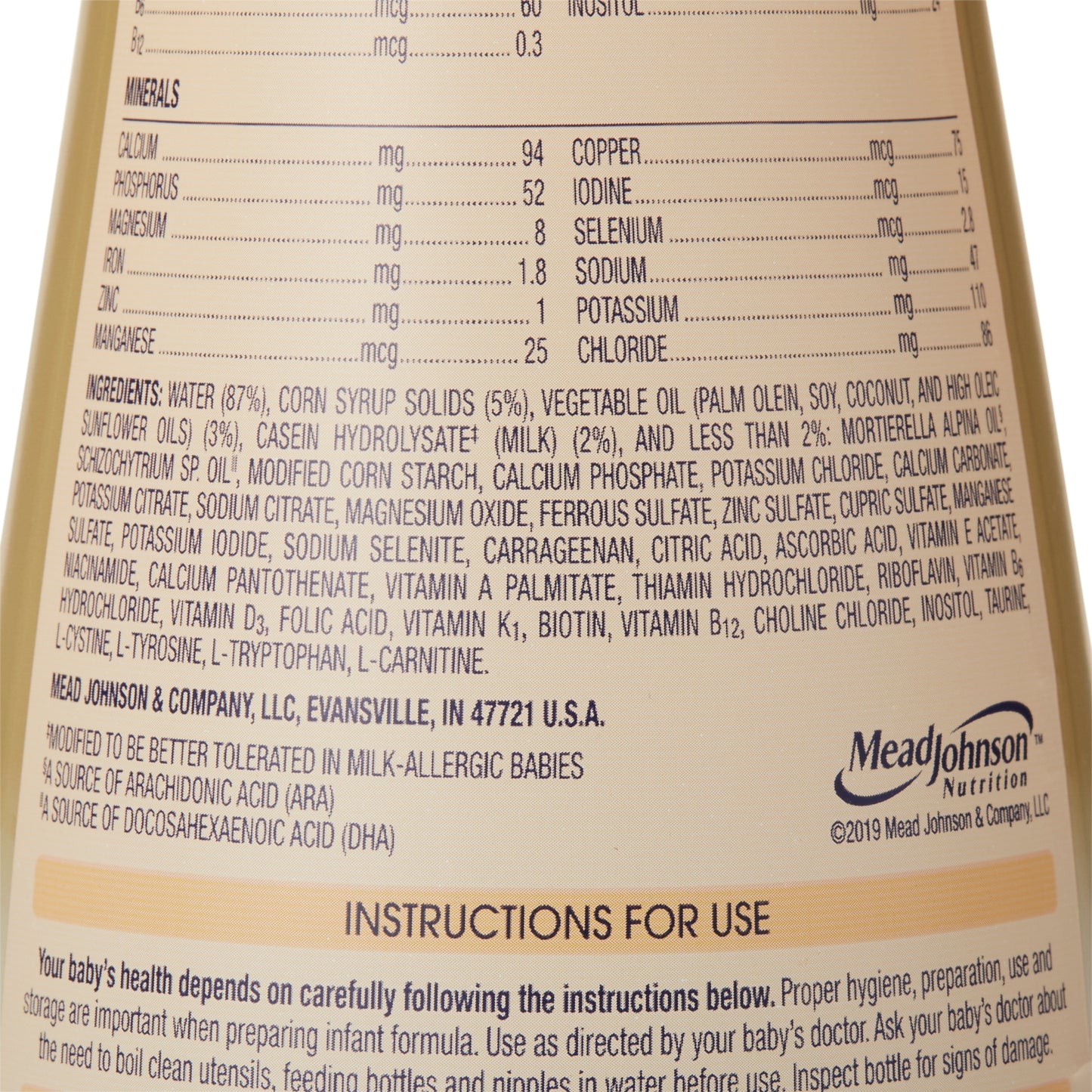 Nutritional label and ingredients list on a Mead Johnson baby formula bottle.