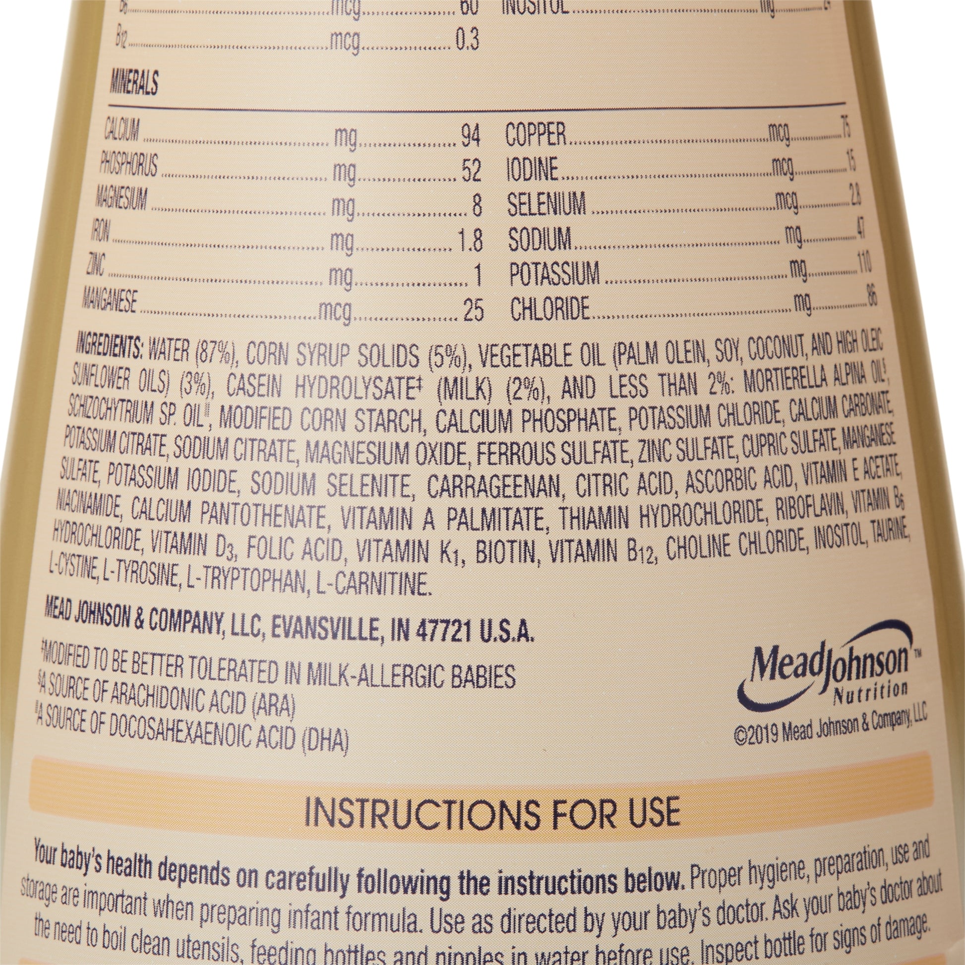 Nutritional label and ingredients list on a Mead Johnson baby formula bottle.