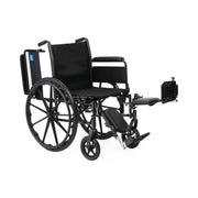 Black wheelchair with attached footrest on a white background