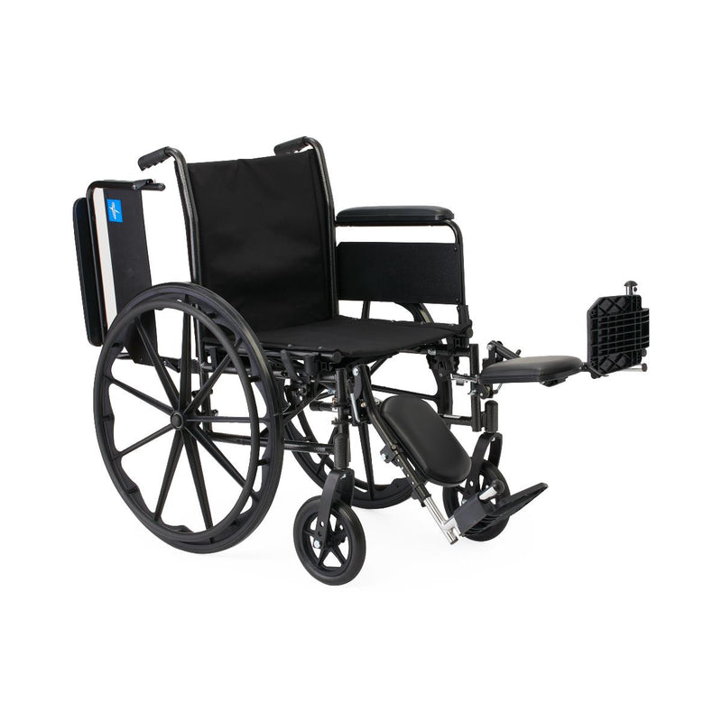 Black wheelchair with attached footrest on a white background
