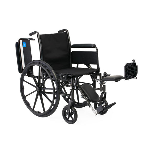 Black wheelchair with attached footrest on a white background