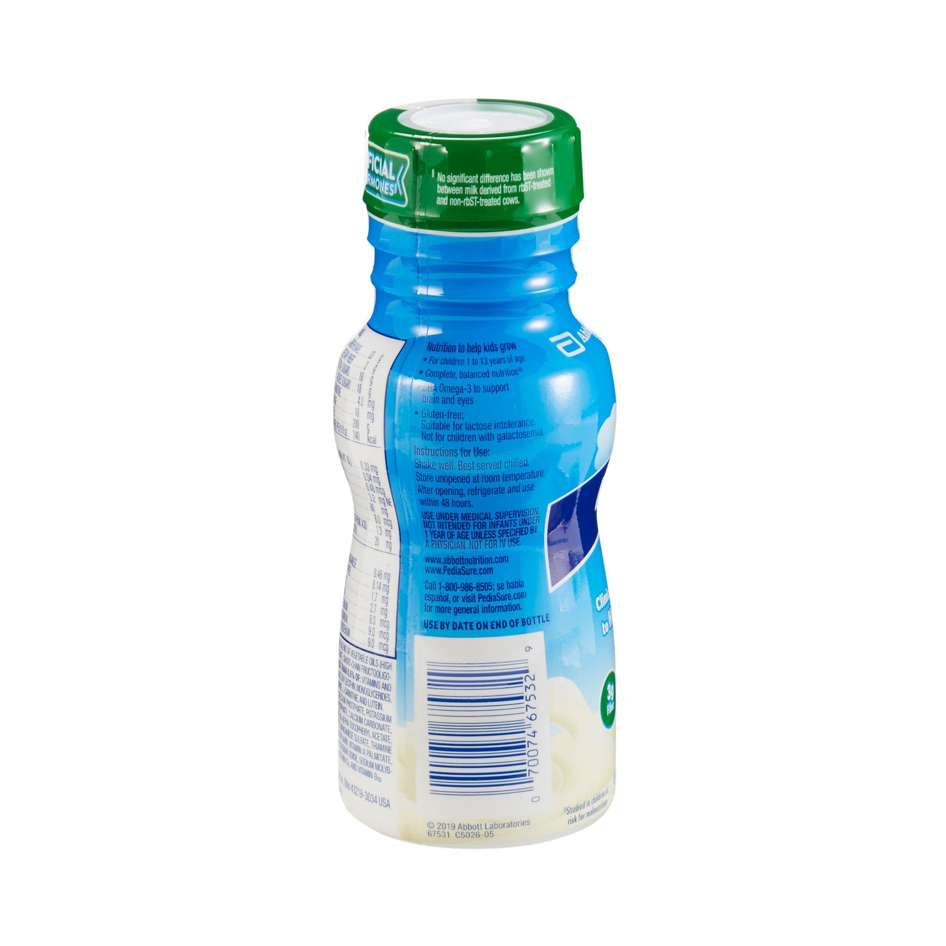 Bottle of milk with a green cap on a white background