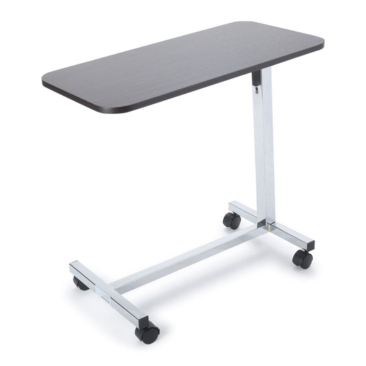 Overbed table with a dark gray top and chrome frame on a white background