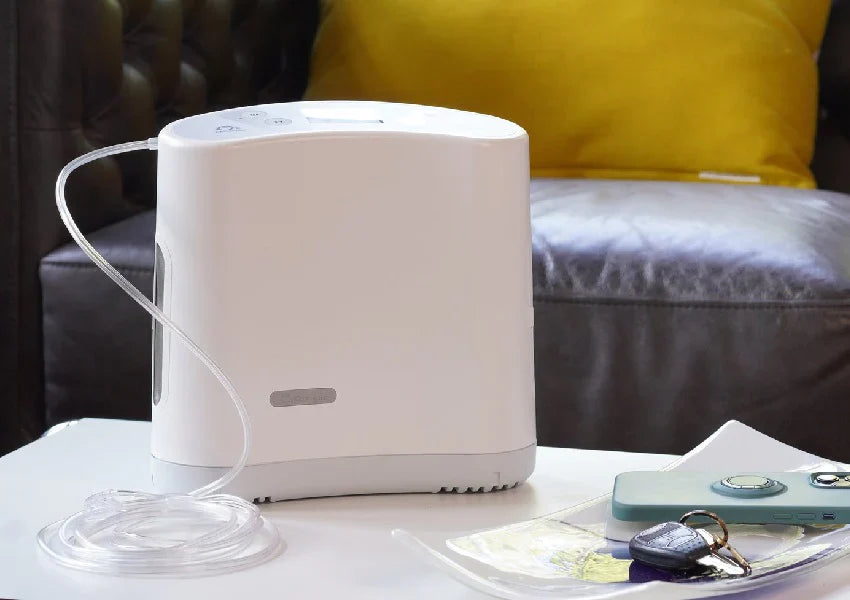 White humidifier on a table with a blurred background