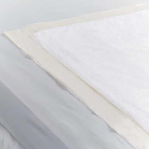 Close-up of a fabric swatch with white, beige, and gray colors.