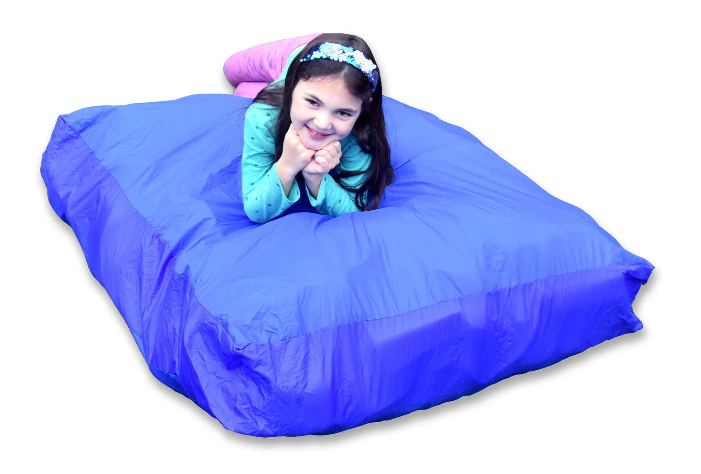Child lying on a large blue bean bag against a white background