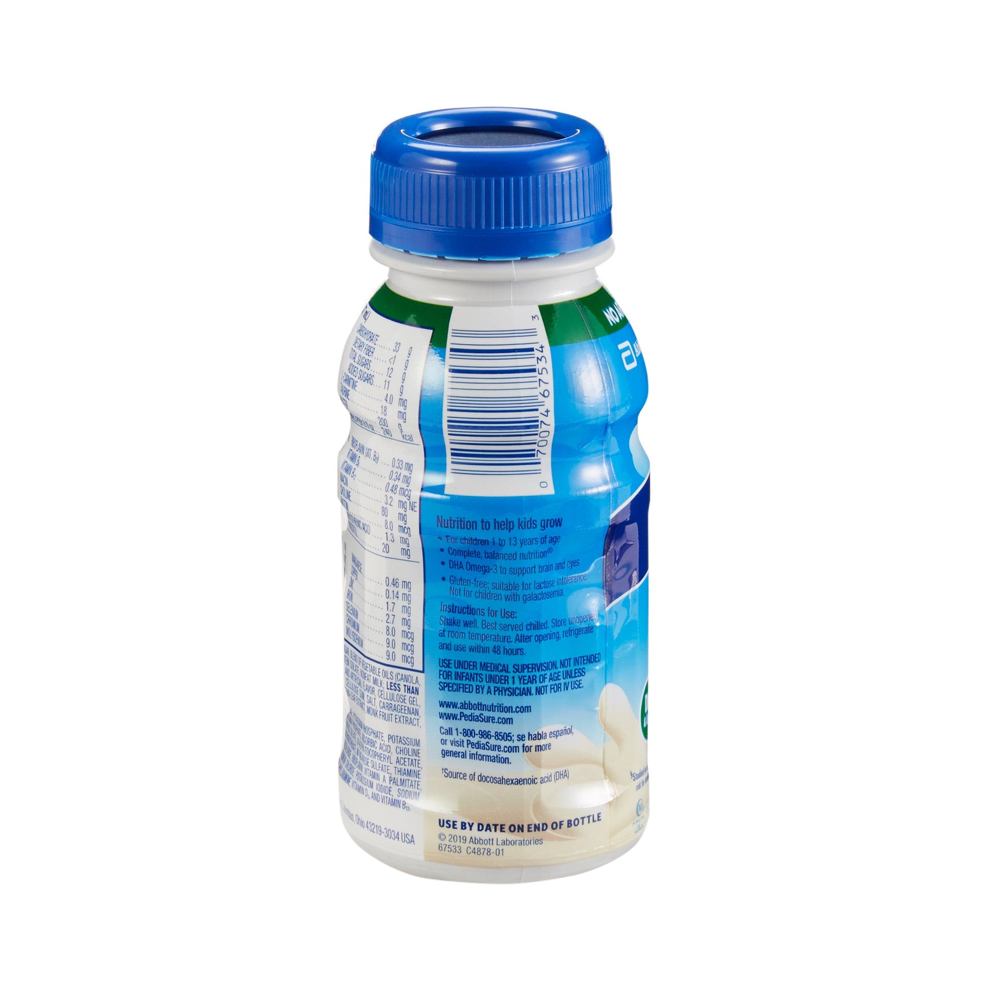 Bottle of milk with blue cap on a white background