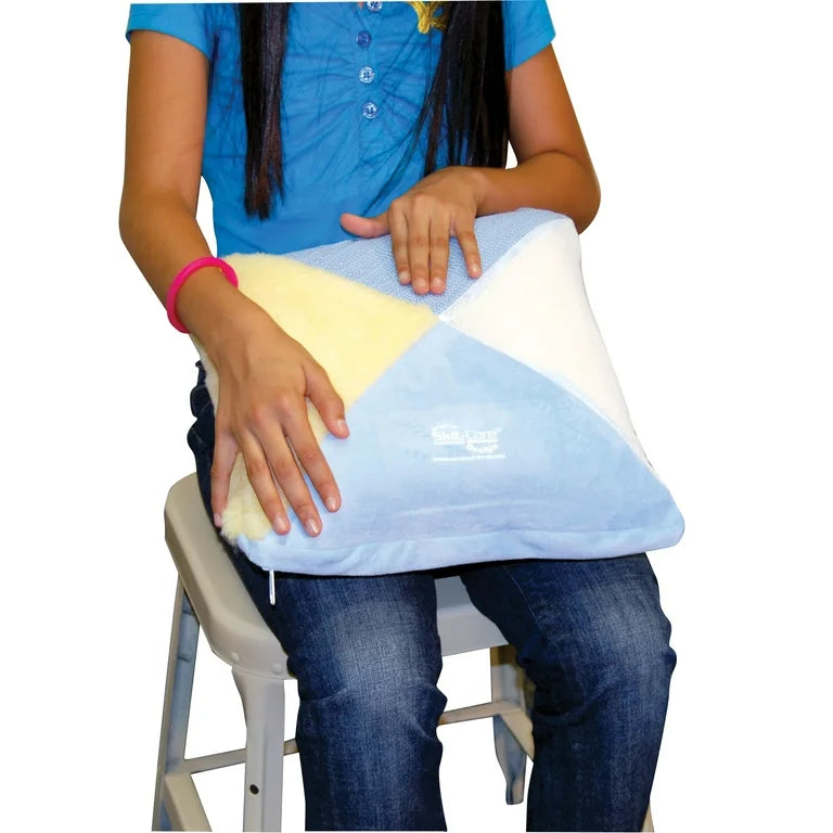Child holding a colorful pillow with a brand logo on a white background