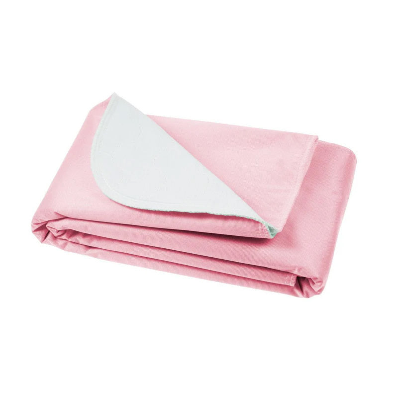 Folded pink blanket with white lining on a white background