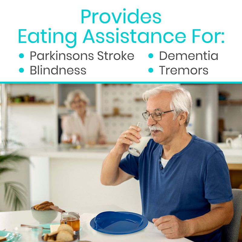 Man with eating assistance using a blue plate and glass in a kitchen setting.