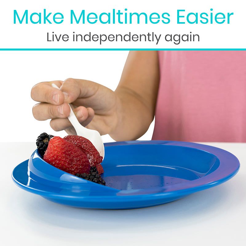 Person using a blue plate with a bowl of fruit, promoting easier mealtimes.