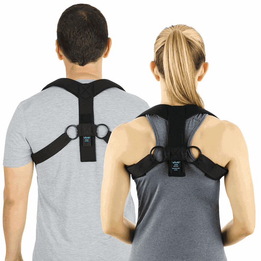 Two people wearing black posture correctors on a white background