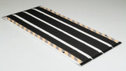 Black and white striped mat on a gray background