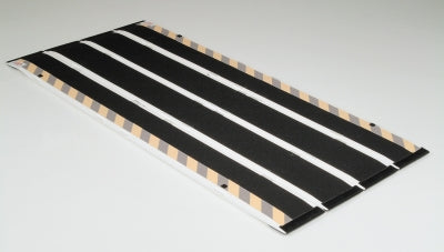 Black and white striped mat on a gray background