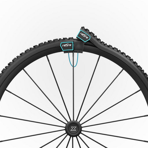 Close-up of a bicycle wheel with Refire branding on a white background