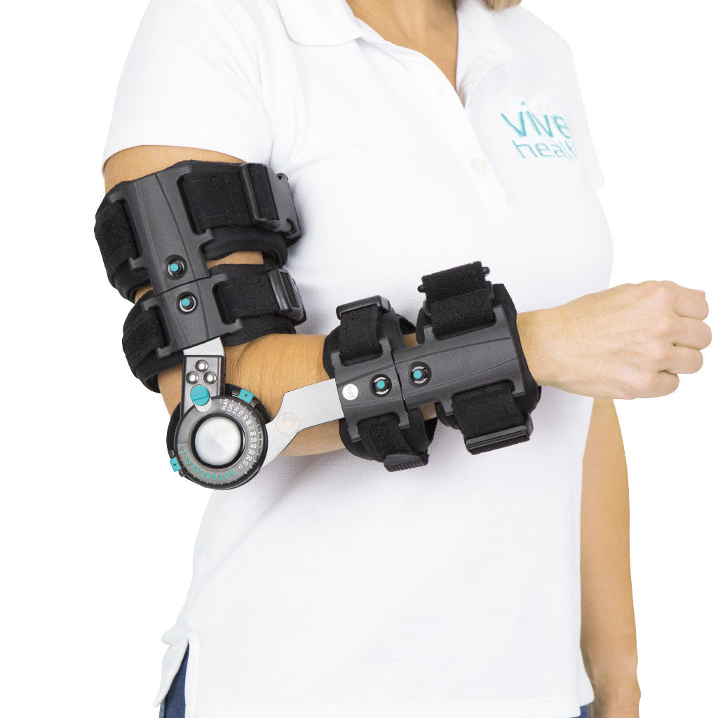 Person wearing a black exoskeleton arm device on a white background