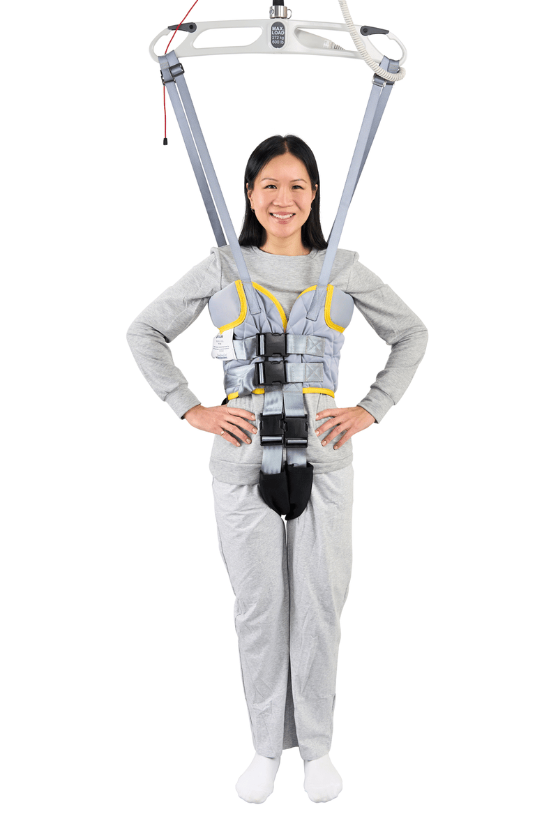 Person wearing a full-body harness on a white background
