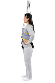 Person wearing a gray safety harness on a white background