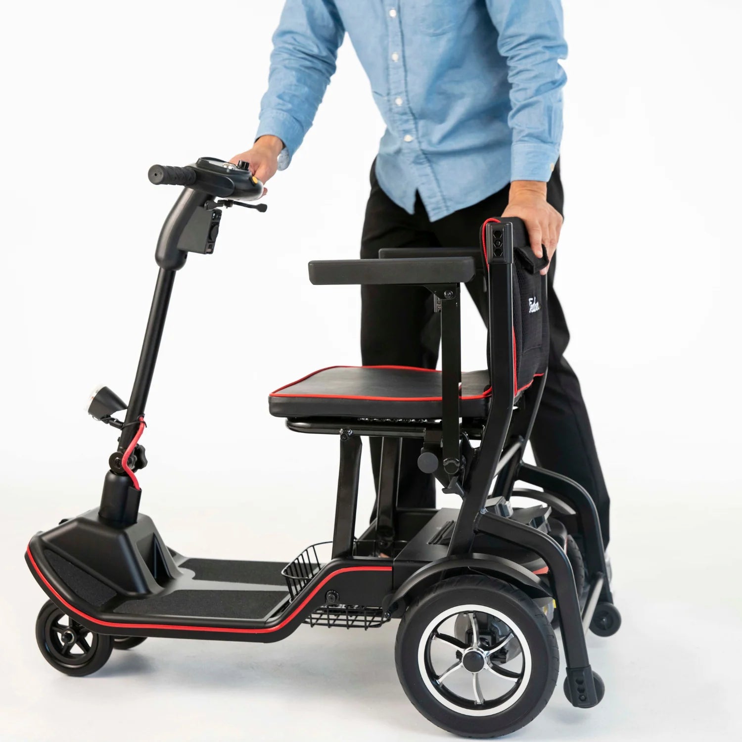Person using a mobility scooter with a seat on a white background