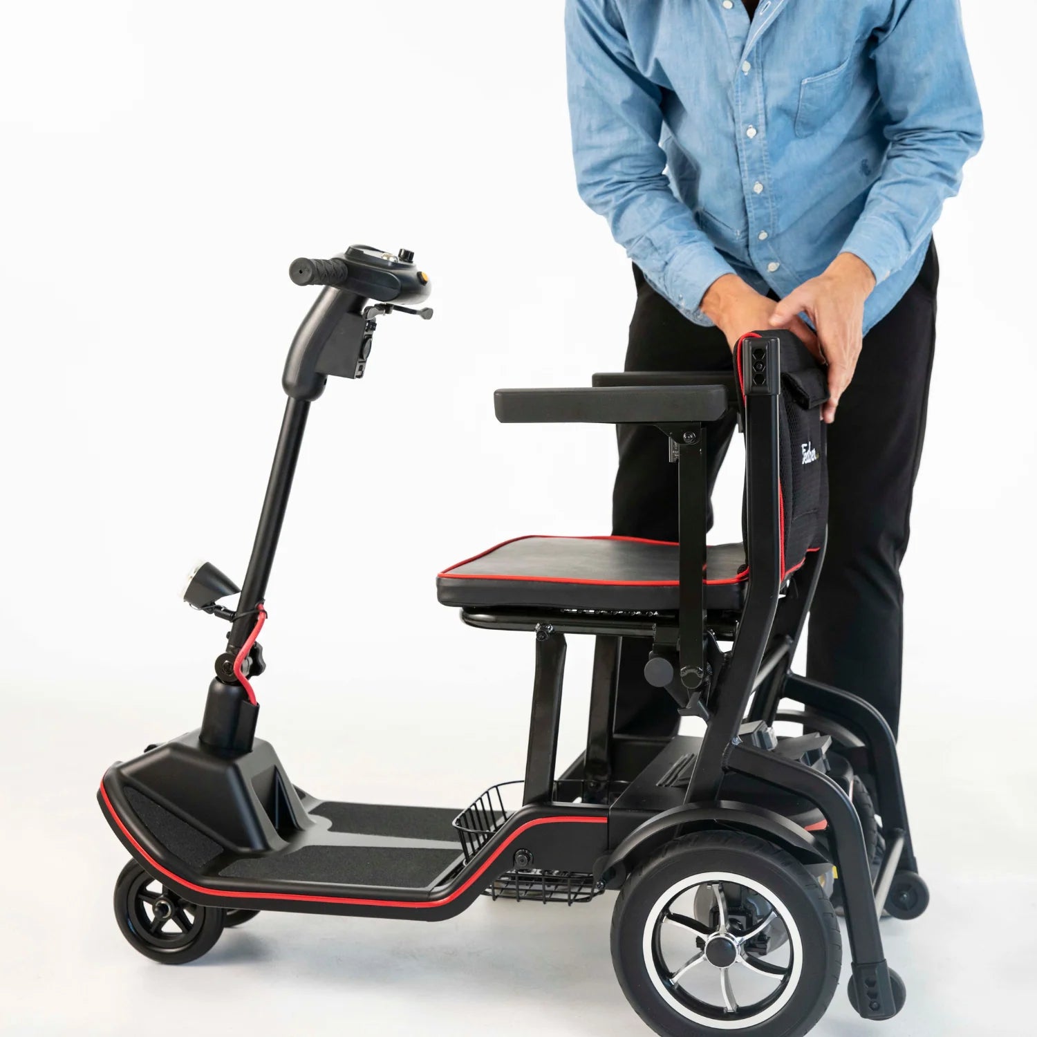 Person using a mobility scooter with a seat on a white background