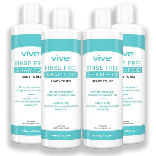 Four bottles of Vive rinse-free shampoo on a white background
