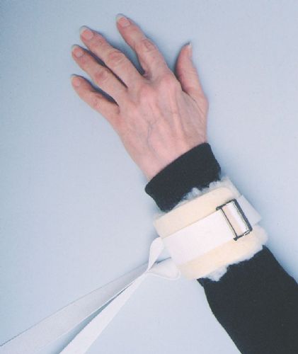 Hand wearing a black sleeve with a white sheath and silver buckle on a light blue background