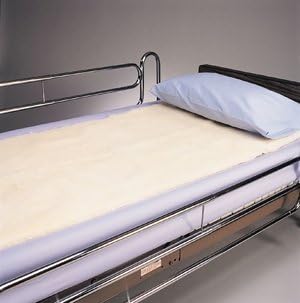 Hospital bed with a pillow and mattress in a clinical setting