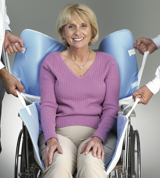 Woman in a wheelchair with a butterfly canopy, smiling.