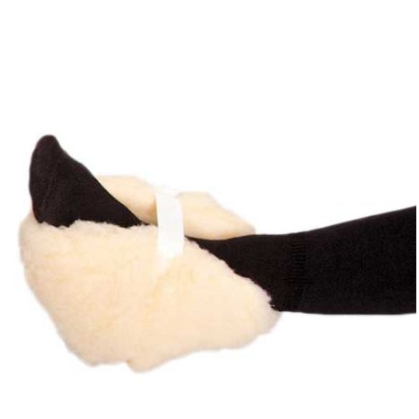 White paw-shaped toy with black accents on a white background
