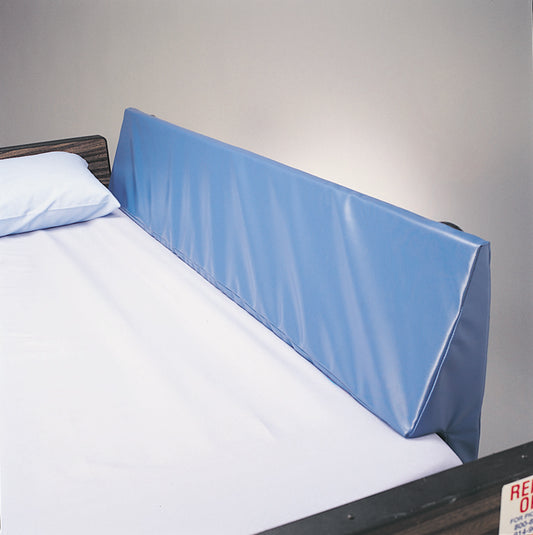 Blue bed safety rail against a gray wall