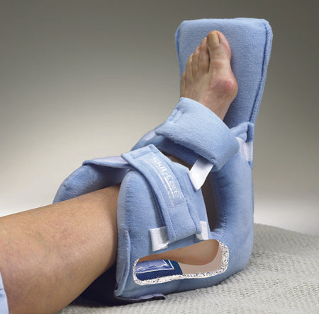 Blue ankle support brace being worn on a foot with a neutral background