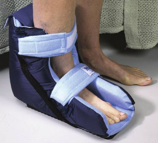Navy blue foot cast or splint with white padding on a person's leg.