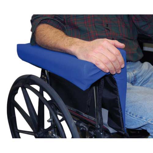 Person using a wheelchair with a blue cushion on the seat