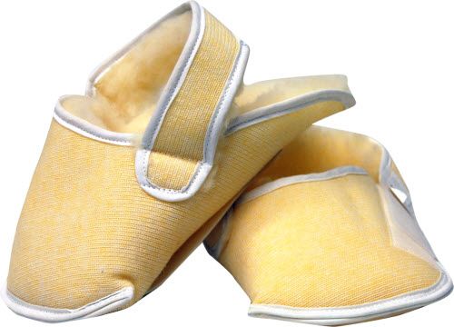 Pair of yellow slippers with white trim on a white background
