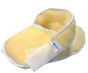 Yellow shoe with a white patch on a white background