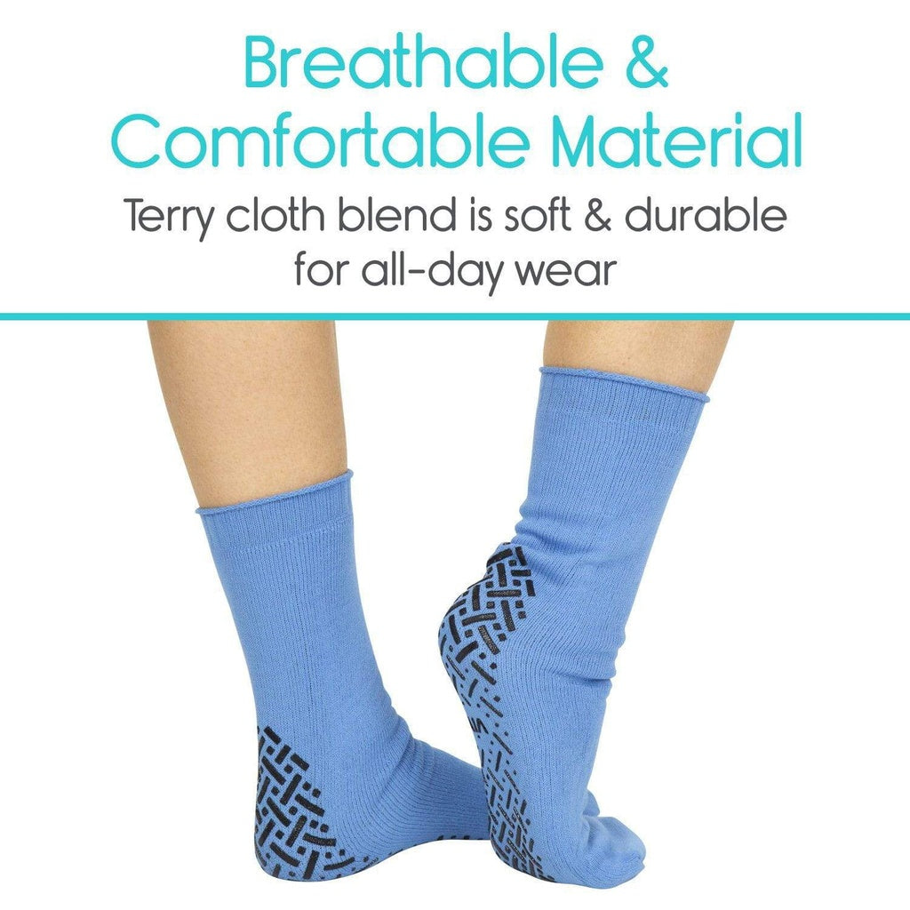 Blue socks with textured sole on a white background, highlighting breathable and comfortable material.