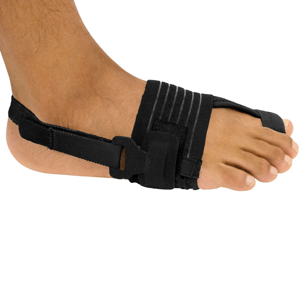Black foot brace on a person's foot against a white background