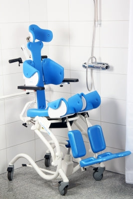 Blue and white medical chair in a bathroom setting