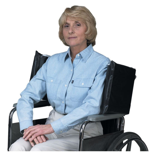 Woman in a wheelchair wearing a light blue shirt on a white background