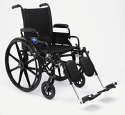 A black manual wheelchair with a high backrest, black fabric seat and armrests, large spoked rear wheels, small front casters, and fold-out footrests, photographed on a clean light gray studio background.