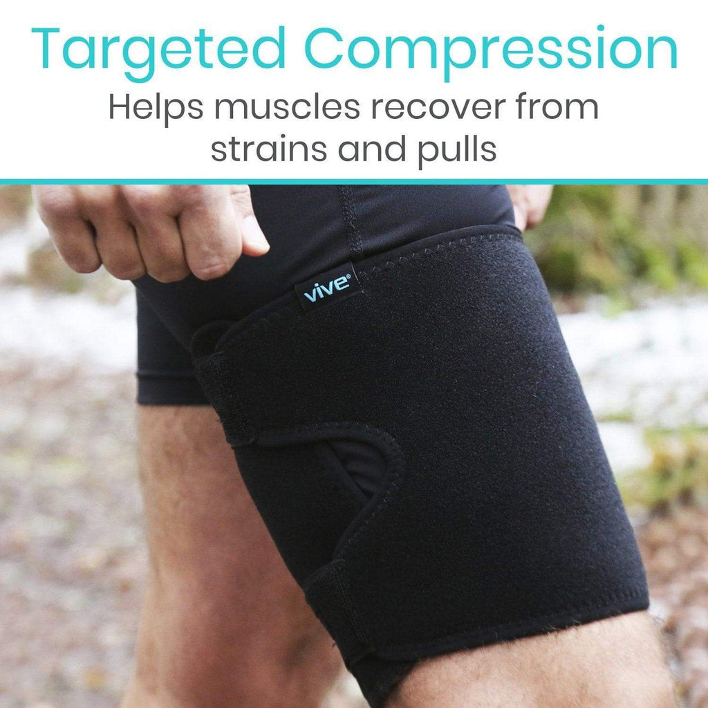 Black compression sleeve on a person's leg with 'vive' branding, set against a blurred natural background.