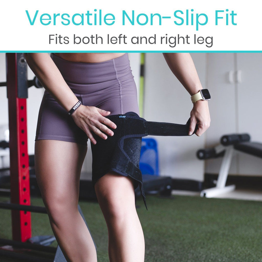Person wearing a black knee support band in a gym setting with text 'Versatile Non-Slip Fit Fits both left and right leg'.