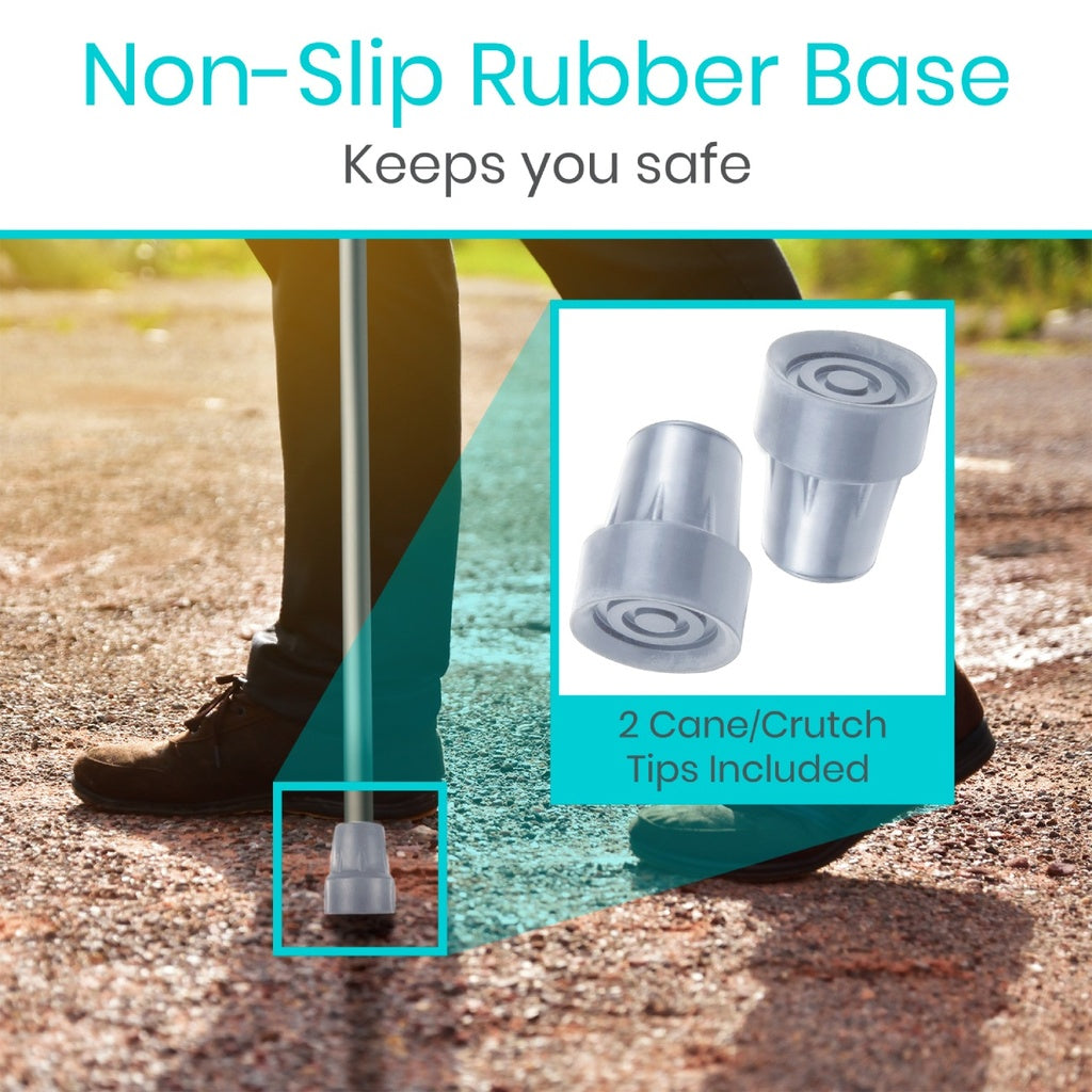 Cane or crutch with non-slip rubber base and safety tips on a blurred outdoor background.