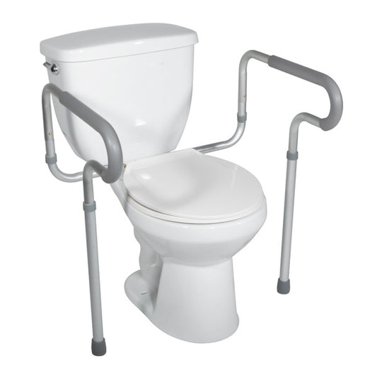 White toilet with a safety frame and handle on a white background