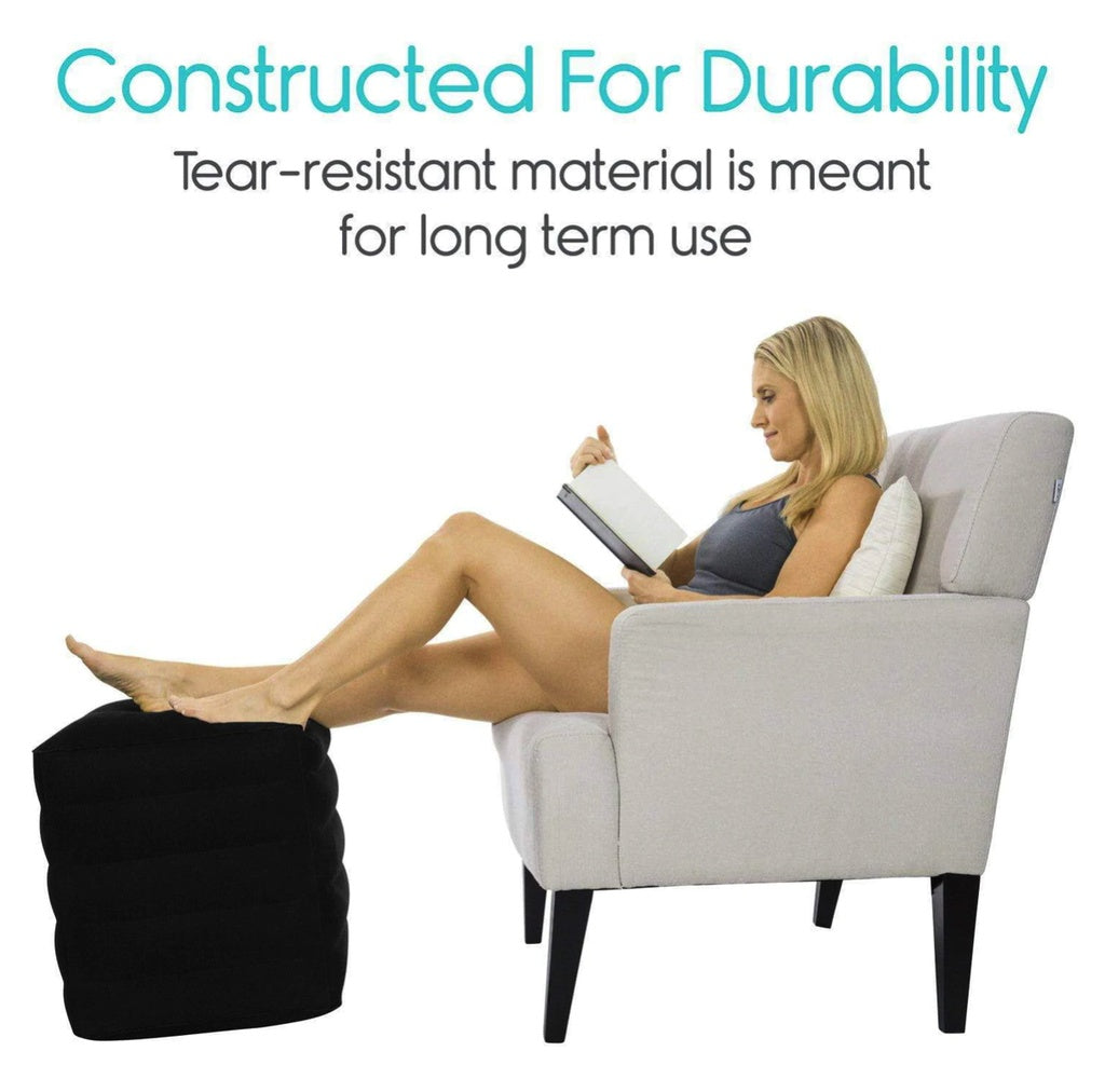 Woman reading a book in a gray armchair with text about durability.