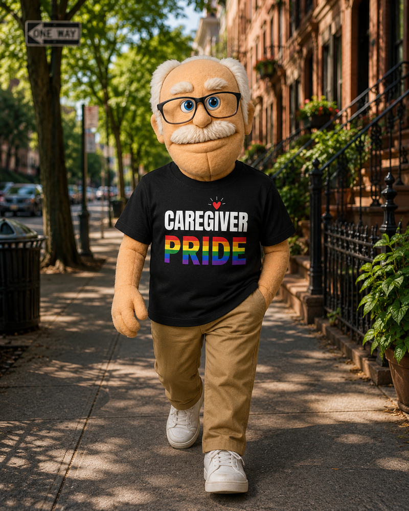 Person  with glasses and a black t-shirt with 'CAREGIVER PRIDE' text, walking on a sidewalk.