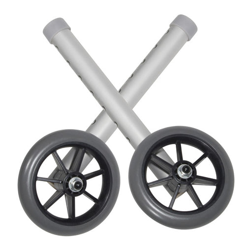 Two crossed metal bars with wheels on a white background