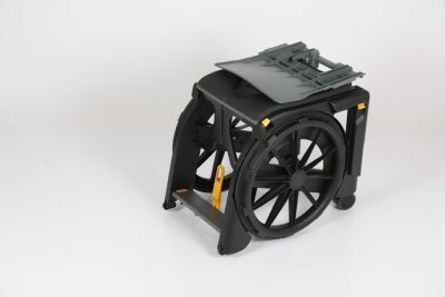 Black robotic device with wheels on a white background